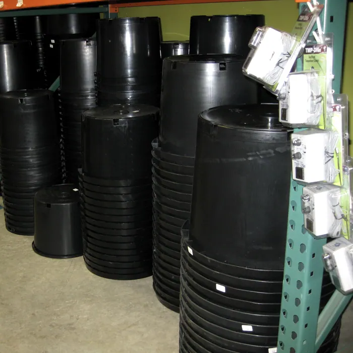 Stacked nursery pots — Rogue Farmers warehouse