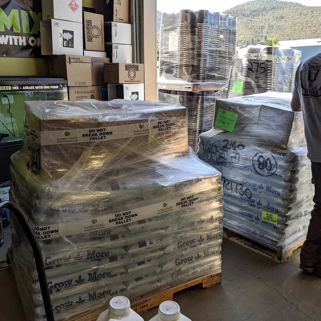 Pallet of Grow More dry fertilizer bags, shrink-wrapped